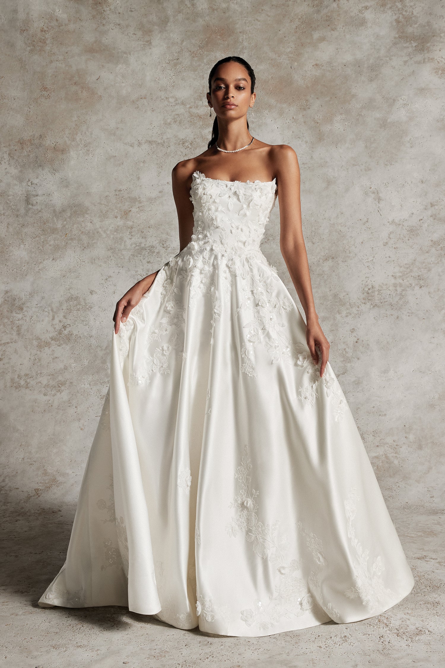 Amani by Justin Alexander Signature The White Flower Amani by Justin Alexander Signature The White Flower